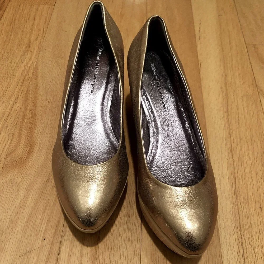 Anthropologie gold gilt